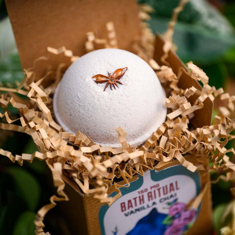 CBD Bath Bomb Vanilla Chai open in packaging sititng in house plants by Appalachian Standard/