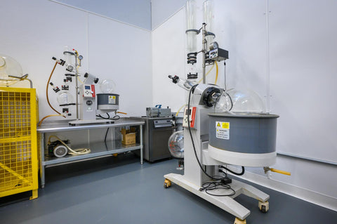 State-of-the-art rotary evaporator and subcritical CO2 extraction equipment in Asheville NC hemp processing laboratory with industrial-grade collection chambers, vacuum systems, and temperature controls for premium cannabis oil production from Western North Carolina's leading extraction facility serving the East Coast.