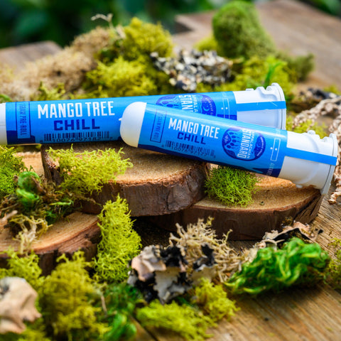 Mango Tree Pre-Rolls in sustainable sana tubes on wood and moss from Appalachian Standard.