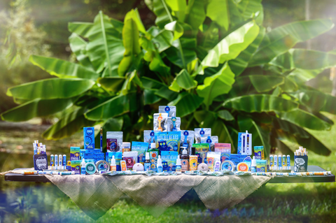The entire line of Appalachian Standard products on a table in front of banana tree.