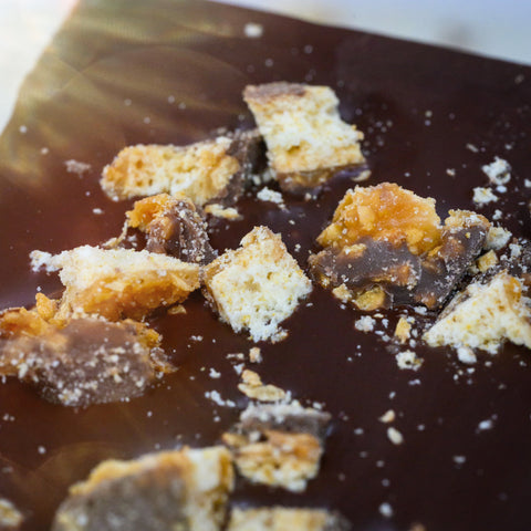 A close-up view of Appalachian Standard's Caramel Bliss Cookie CBD Chocolate with chunks of cookie