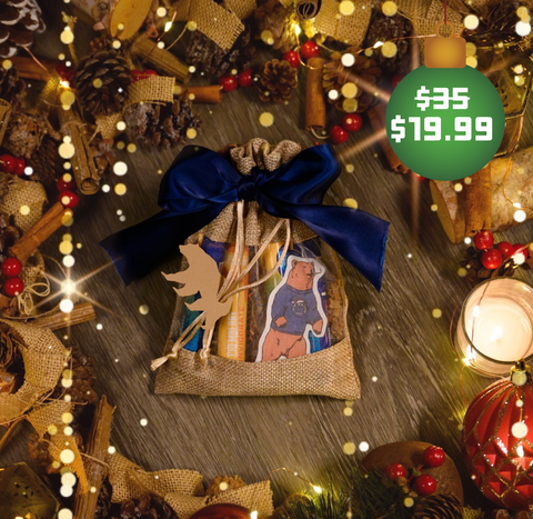 Appalachian Standard's Smokey Bear CBD Rollie Flight surrounded by Christmas decorations, including candles, pine cones, and Christmas ornaments
