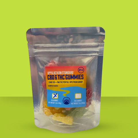 A package of Appalachian Standard full-spectrum CBD and THC gummies, featuring flavors such as lemon, orange, cherry, green apple, and watermelon. The package indicates 21+ and contains 10 gummies with a net weight of 140g.