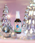 A photo of Appalachian Standards Limited Edition, Holiday Inn Paradise Body Oil surrounded by shiny glass decor christmas trees and disco balls.