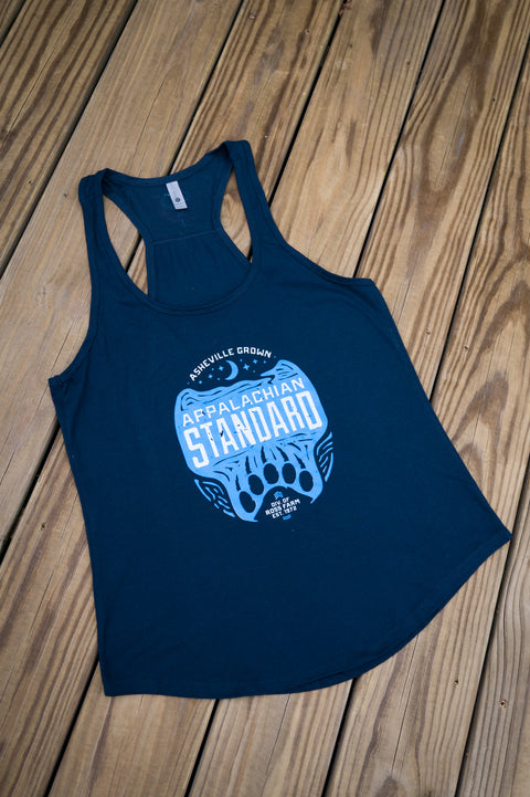 Navy blue tank top with white and blue graphic design on a wooden surface