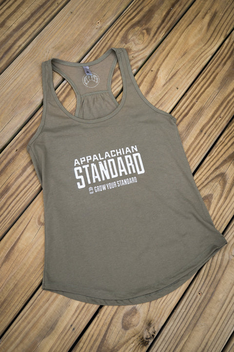 Green tank top with 'Appalachian Standard' text on a wooden surface