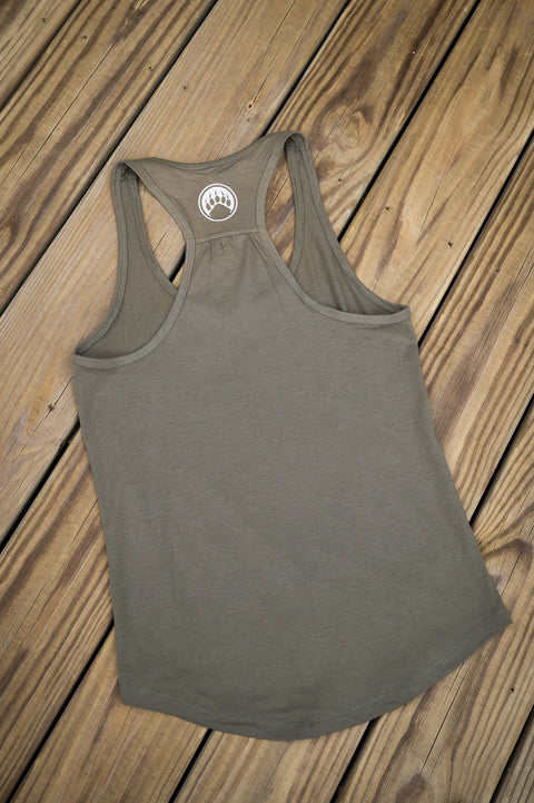 Green tank top with a logo on a wooden surface