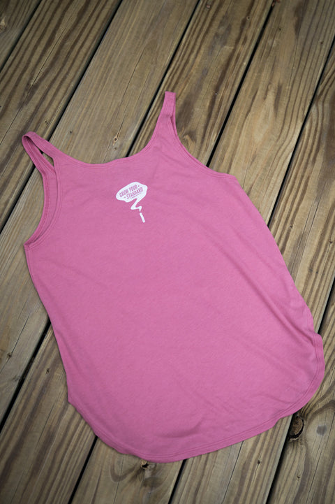 Pink tank top with a logo on a wooden surface