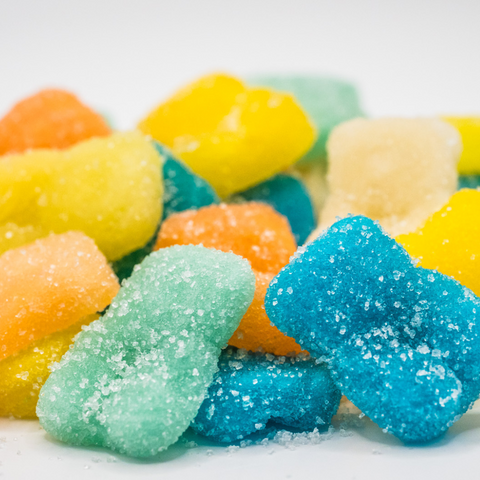 Colorful gummy bears on a white background