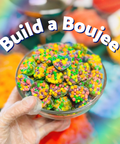 Hand holding a bowl of colorful candy with 'Build a Boujee' text overlay.