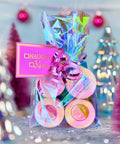 Appalachian Standard's decorative gift with colorful candy and 'Naughty or Nice' tag against a blurred festive background