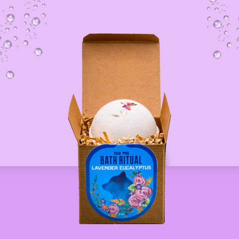 Bath bomb in a cardboard box with a decorative label on a purple background