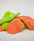 CBD Sour Gummy candy in green and orange on a white background.
