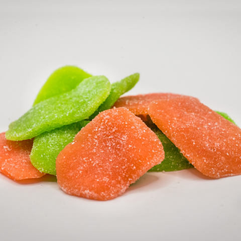 CBD Sour Gummy candy in green and orange on a white background.