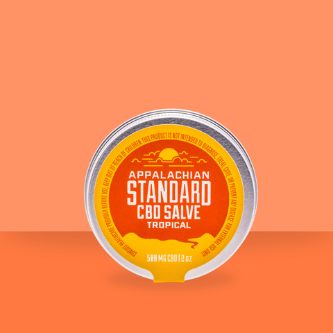 Appalachian Standard's Tropical CBD Salve on an orange background.