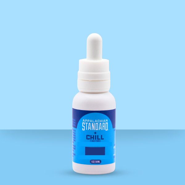 Appalachian Standard's Chill Tincture in a white bottle with blue label on a blue background