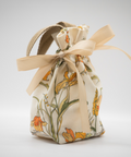 Fabric drawstring bag with floral pattern on a light gray background for Appalachian Standard's High Country Hunny fall CBD body cream launch.