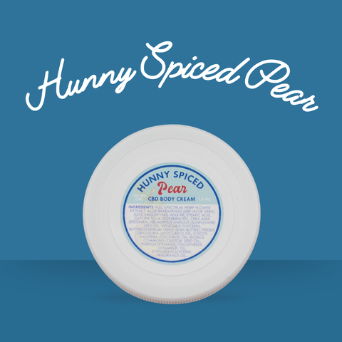 White cylindrical container with a blue label on a blue background, featuring 'Hunny Spiced Pear' text for Appalachian Standard's CBD body cream.