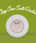 Appalachian Standard's Cozy Sea Salt Orchid CBD body cream on a green background