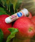 Apple flavored vape in packaging on red apples by Appalachian Standard
