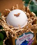 CBD Bath Bomb Vanilla Chai open in packaging sititng in house plants by Appalachian Standard/