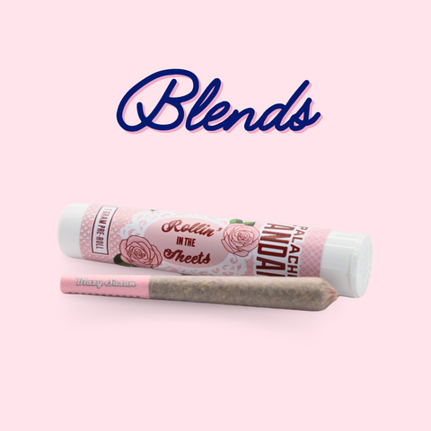 Two rolled-up joints with pink packaging on a light pink background, featuring the brand 'Blends'.