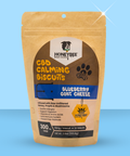 Package of Honeybee CBD Calming Biscuits on a blue background