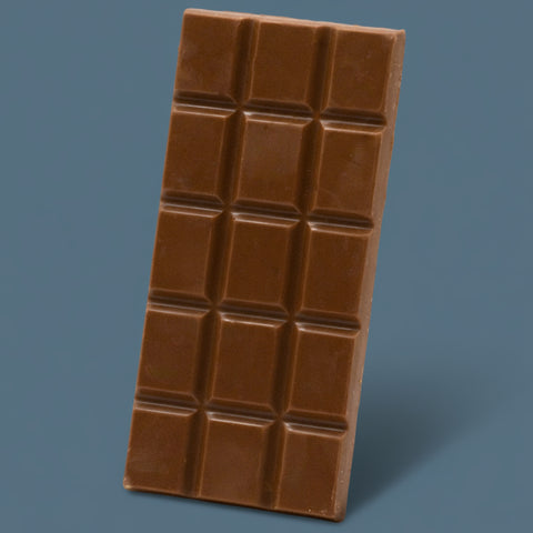 Appalachian Standard's Salted Croissant THC Chocolate bar with a grid of squares on a blue background