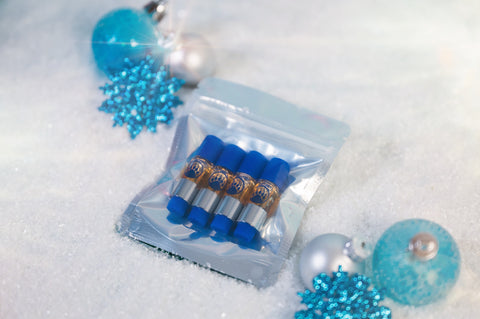 Packaged blue and silver items on a snowy background