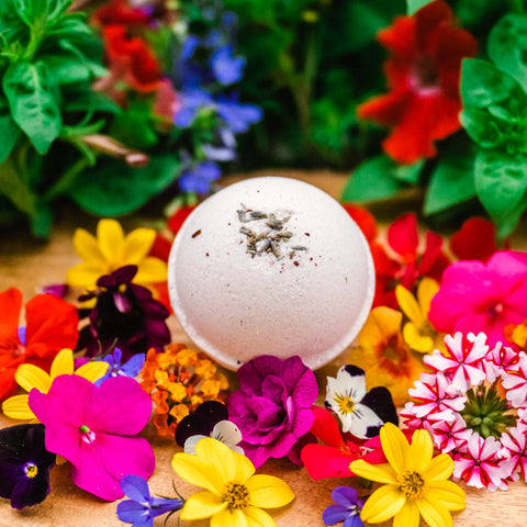 Appalachian Standard's Lavender Eucalyptus CBD Bath Bomb on a bed of flowers