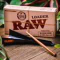 RAW Loader Hemp and CBD Tool for Loading Cones from Appalachian Standard. Black plastic funnel with wooden poker.
