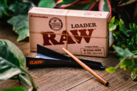 RAW Loader Hemp and CBD Tool for Loading Cones from Appalachian Standard. Black plastic funnel with wooden poker.