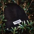 Black Beanie Hat with Appalachian Standard in a bush