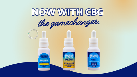 3 white bottles of tincture lined up with blue labels on a orange background with blue wave at the bottom