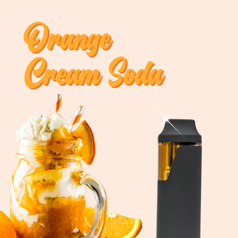 Appalachian Standard Orange Cream Soda vape pen in matte black and gold displayed alongside a mason jar orange cream soda float topped with vanilla ice cream, orange slices, and striped paper straws on a soft peach background.