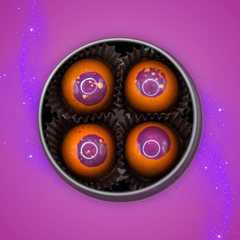Appalachian Standard's limited edition Ross's Peanut Butter BonBons, eight glossy orange chocolates with purple tops in an open tin, on a sparkly purple background