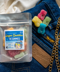 Appalachian Standard Sugar Daddies 10-pack THC gummies styled on denim wrangler jeans with gold chain and leather wallet for Father's Day.