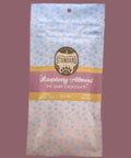 Appalachian Standard's  raspberry almond THC dark chocolate packaging on a pink background