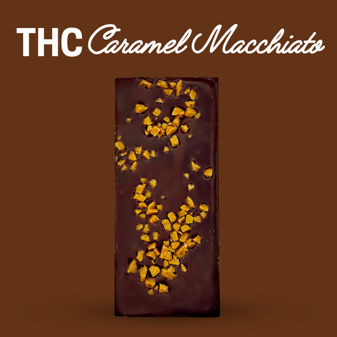 Chocolate bar with caramel pieces on a brown background, labeled 'THC Caramel Macchiato'.