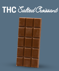 Appalachian Standard's Salted Croissant THC Chocolate bar with a grid of squares on a blue background