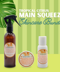 Appalachian Standard Tropical Citrus Main Squeeze CBD Skincare Bundle featuring a 250mg CBD After-Sun Mist spray, 188mg CBD Body Cream, and 200mg CBD Body Lotion on a green striped background with a monstera leaf.