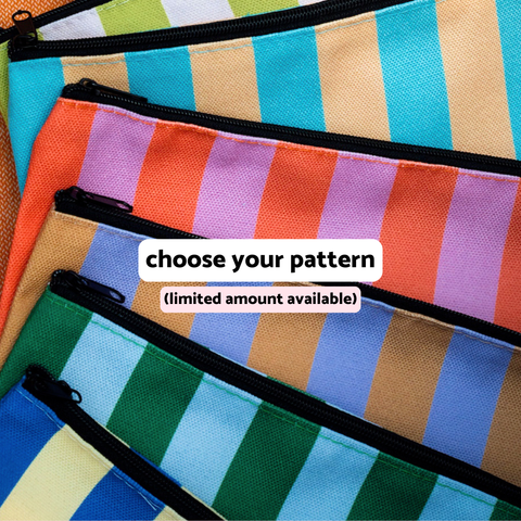 Six colorful striped zip pouches in assorted patterns — green and white, blue and tan, orange and lavender, periwinkle and brown, light blue and green, dark blue and yellow — available with the Appalachian Standard Main Squeeze Skincare Bundle, limited quantities available.