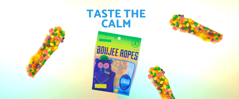 A package of Boujee Ropes candy in the center with three loose boujee ropes floating around it on a light gradient background. The text 'TASTE THE CALM' is written at the top.