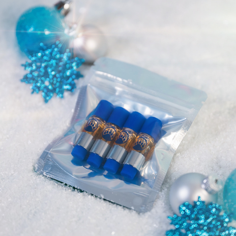 Clear plastic packaging with blue cylindrical items on a snowy background