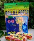 A bag of Appalachian Standard's Boujee Ropes and three pieces of Boujee Ropes in front of plants