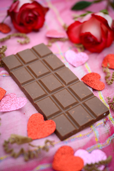 A bar of Appalachian Standard's Salted Croissant CBD Chocolate in a Valentine's Day setting