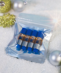 Packaged product with blue caps and gold labels on a snowy background