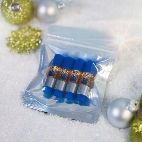 Packaged product with blue caps and gold labels on a snowy background