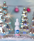 Bottle of peppermint extract with a blurred festive background