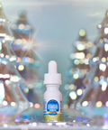 Bottle of candy cane-flavored vape juice with blurred Christmas trees in the background